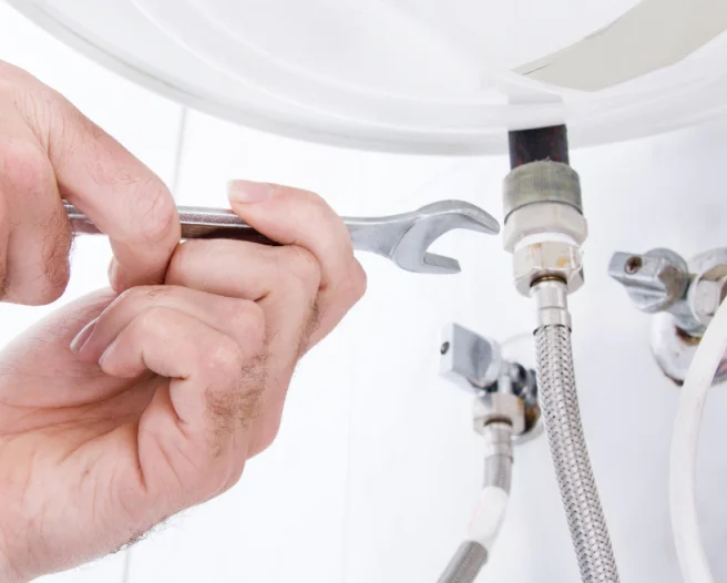 close up of plumbing in bathroom